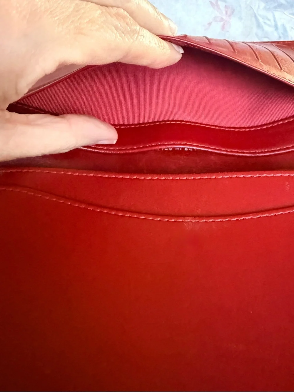 Authentic CHANEL Quilted Red Lambskin Leather Long Wallet with Silver CC Emblem.